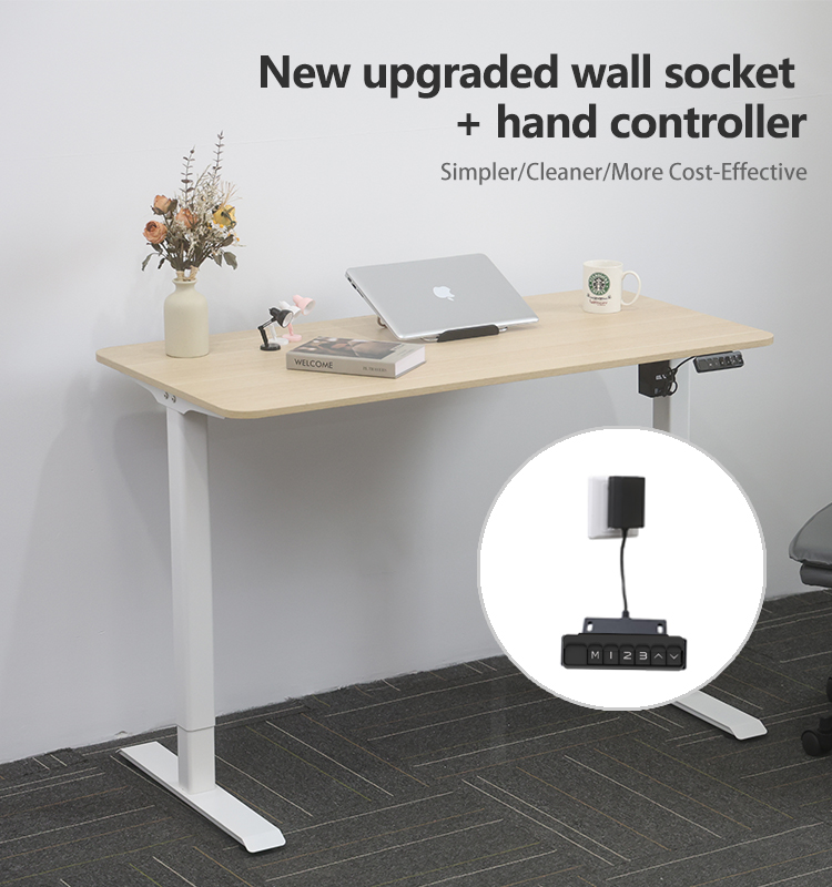A complete modern adjustable desk with text highlighting the new upgraded wall socket and hand controller, described as simpler, cleaner, and more cost-effective.