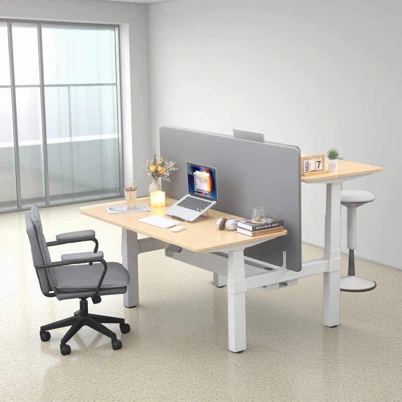 A modern dual-person, height-adjustable workstation with one side lowered for sitting and the other raised for standing.