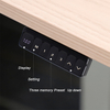 A close-up of the control panel for a height-adjustable desk, showing an LED display, a memory setting button, three memory preset buttons, and up and down arrow buttons for manual adjustment.