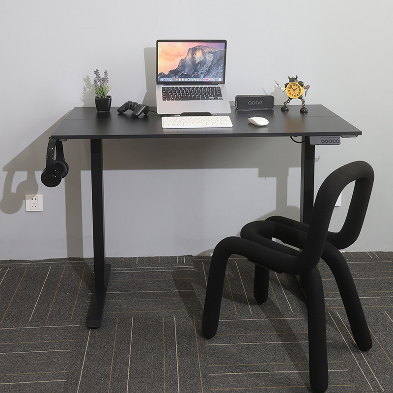 The versatile SACR2 sit-stand Gaming Setup desk as a centerpiece of stylish home office furniture, shown with a modern chair and a complete computer setup.