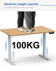 A powerful demonstration of the standing desk's stability, with two people standing on the tabletop to showcase its 100KG load capacity.