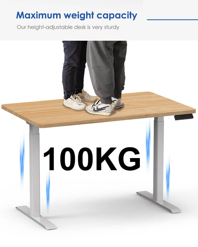 A powerful demonstration of the standing desk's stability, with two people standing on the tabletop to showcase its 100KG load capacity.