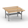 Gray electric standing desk frame with desktop surface, combining durability and aesthetic appeal for modern offices