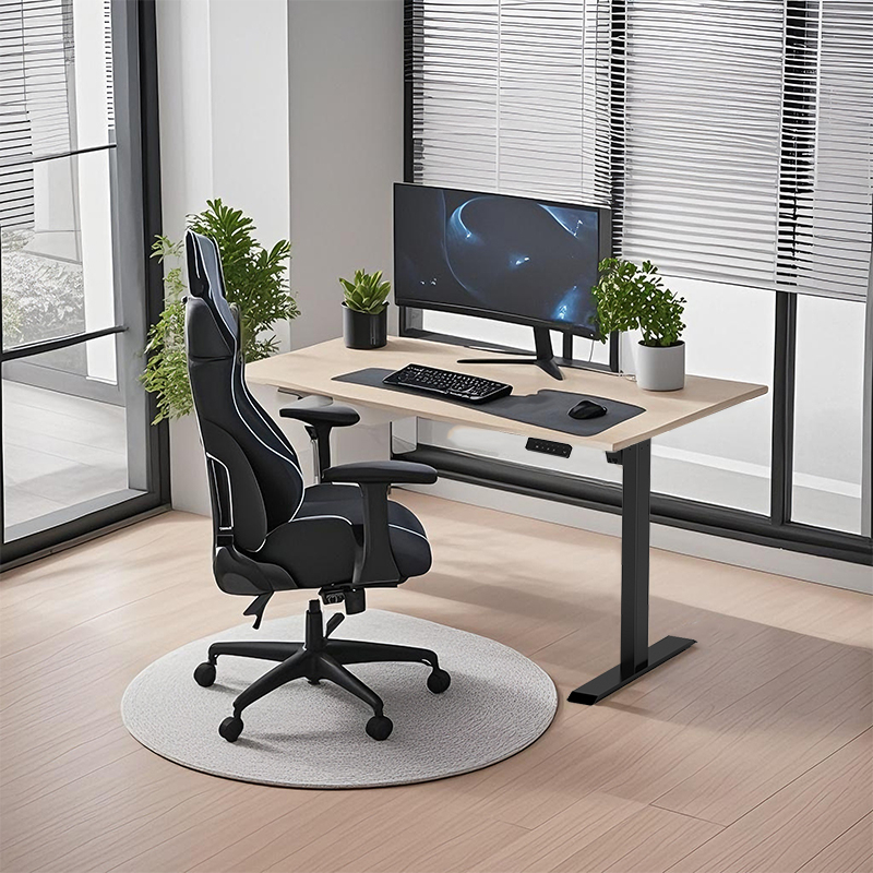  A black height-adjustable desk with a light wood tabletop set up in a home office, complete with a gaming chair, a curved monitor, a keyboard, a mouse, and two small potted plants.
