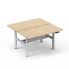 4CF3A back-to-back dual workstation with light white oak desktops and a white electric frame, ideal for ergonomic office setups.