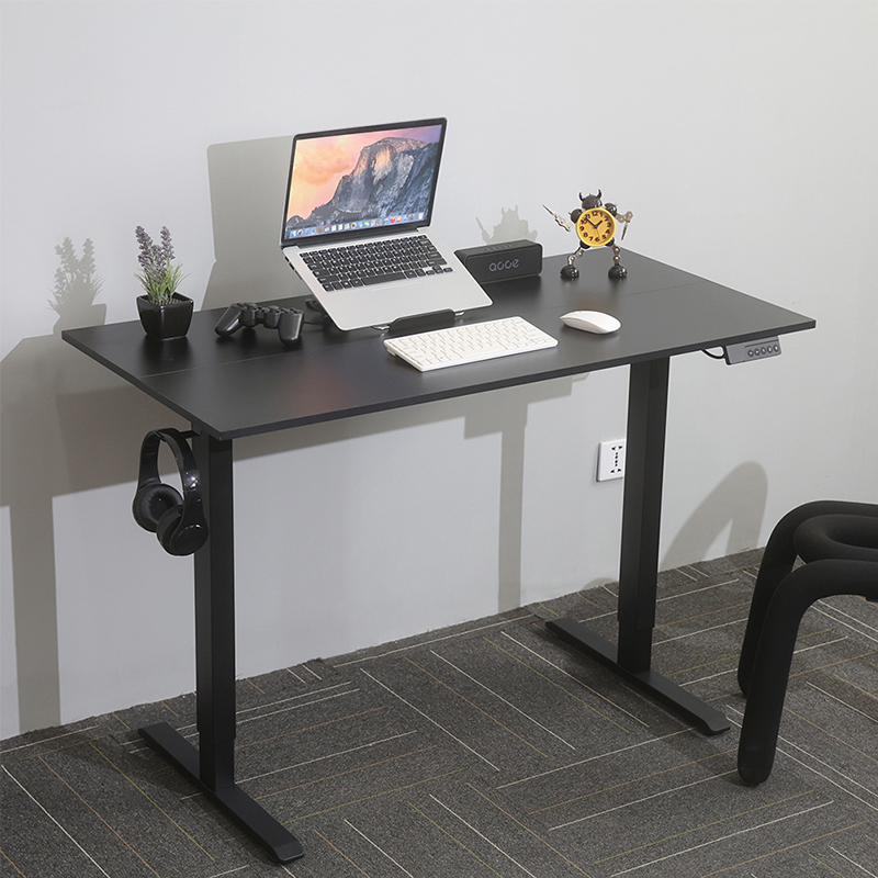 A clean and modern work-from-home setup on the SACR2 standing desk, showcasing its ample space for a laptop, accessories, and a tidy workspace.