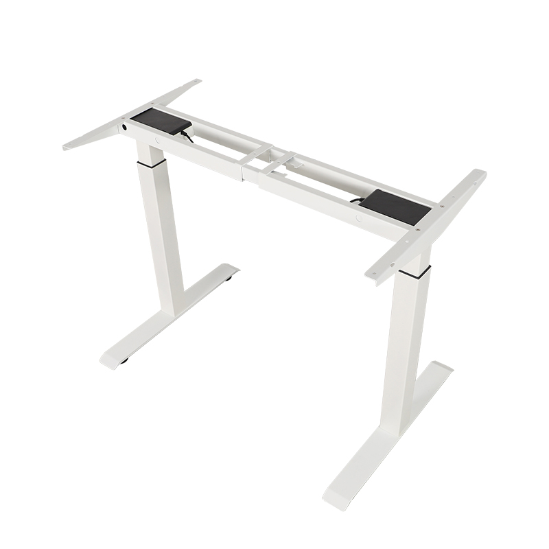 Angled overhead view of white 2B2 adjustable desk frame with legs, central beam, and motor boxes on a white background.