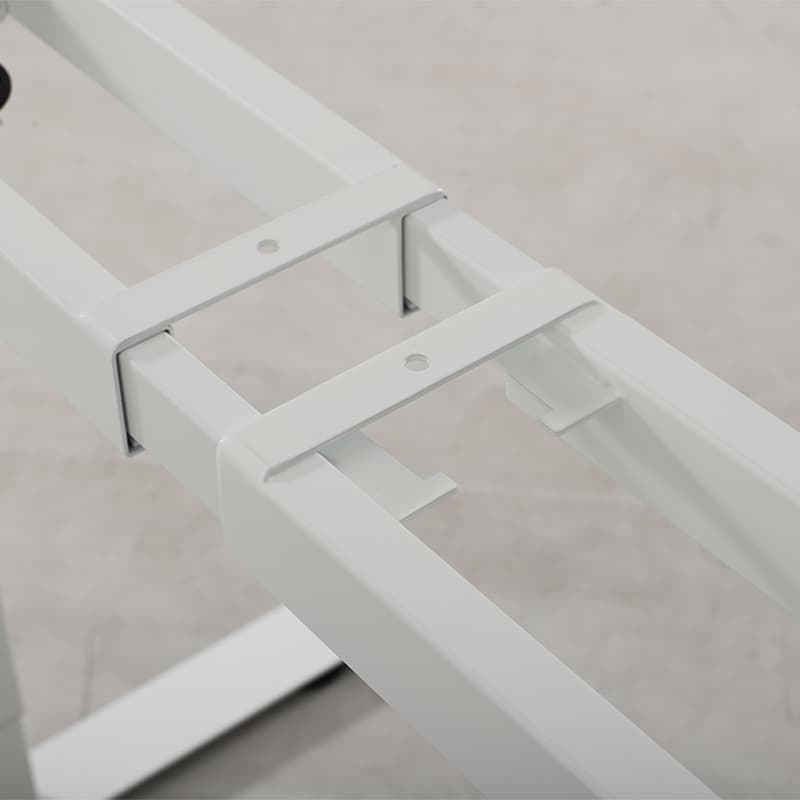 A detailed close-up shot of the adjustable central beam of the white 2AR2 standing desk frame, showing how the width can be extended.