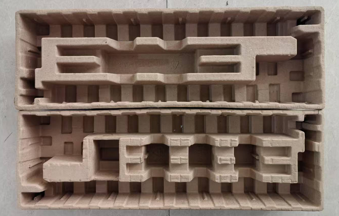 Molded pulp packaging tray for standing desk frame components