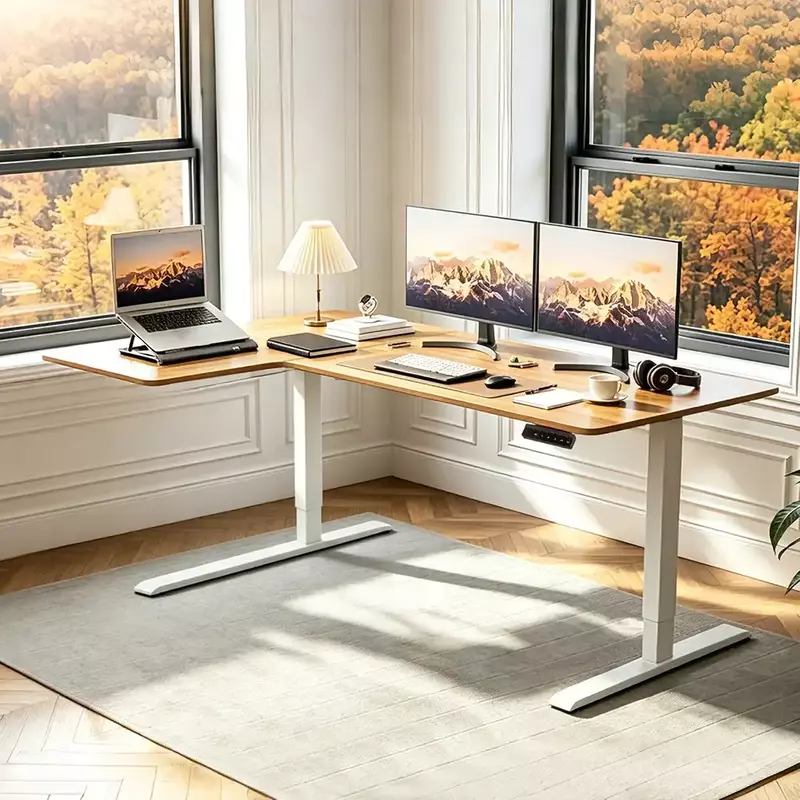 White L-shaped standing desk frame with tabletop scene